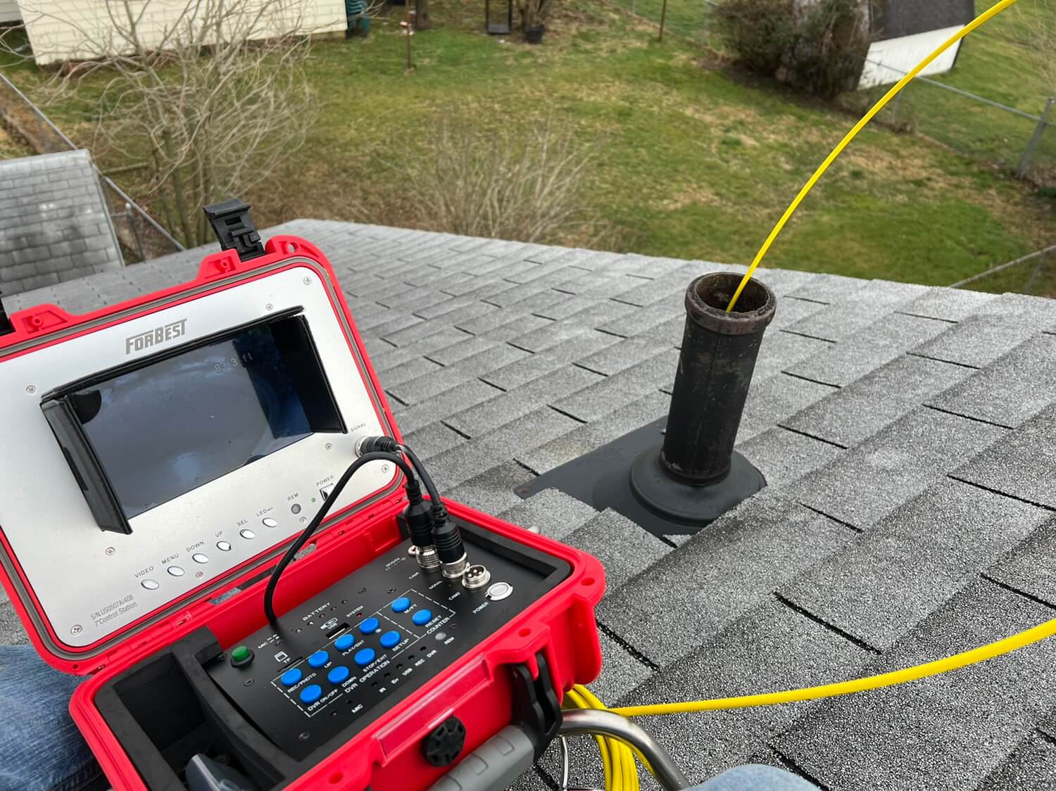 Performing Sewer scope inspection from roof